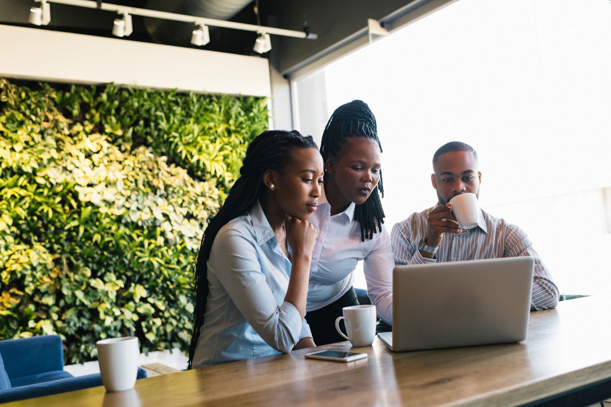 Professional software development team collaborating in a modern office