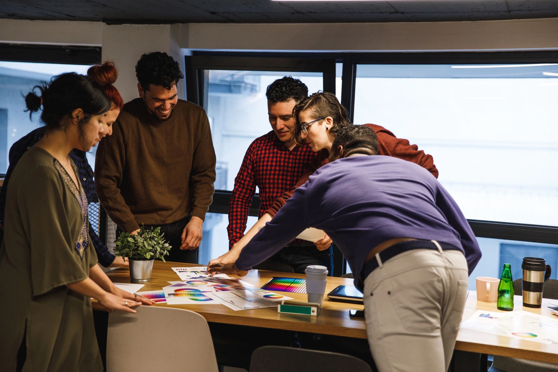 Design team collaborating on a user experience project in a modern office